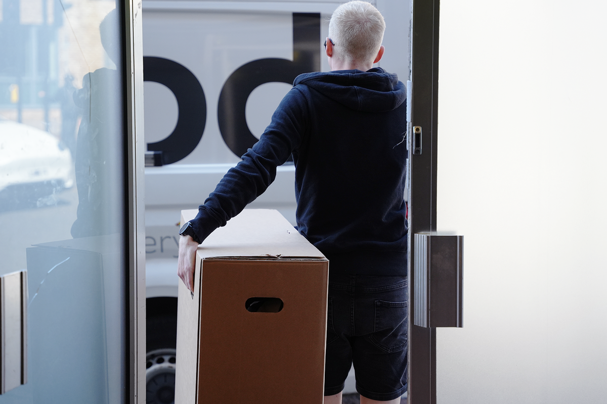 A boxed bike being delivered